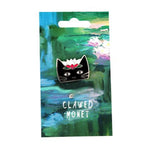 Pin with a black cat design on a card featuring a water lily painting, labeled 'Clawed Monet'.